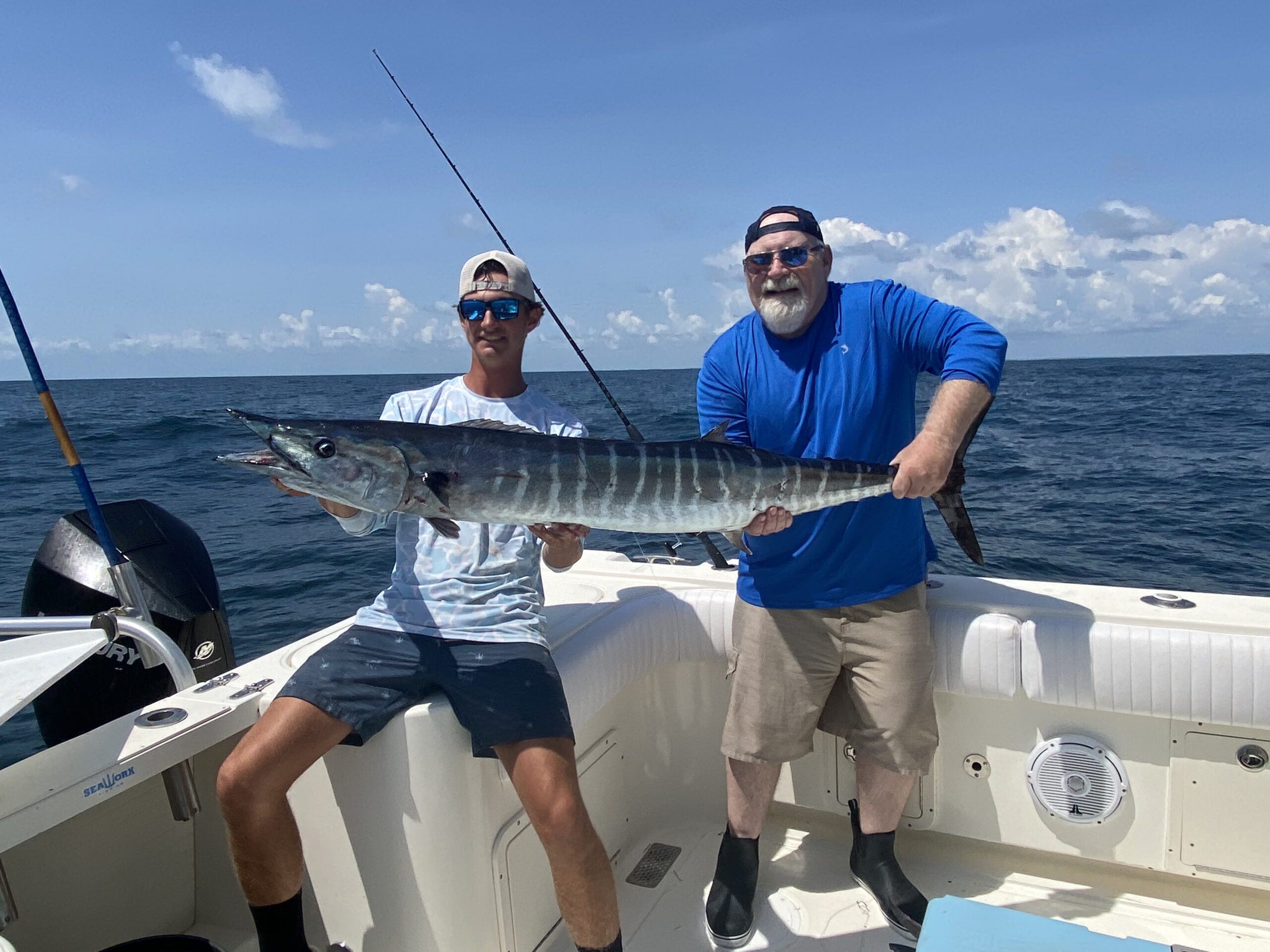 Two anglers with a wahoo catch on an 8 hour offshore trip